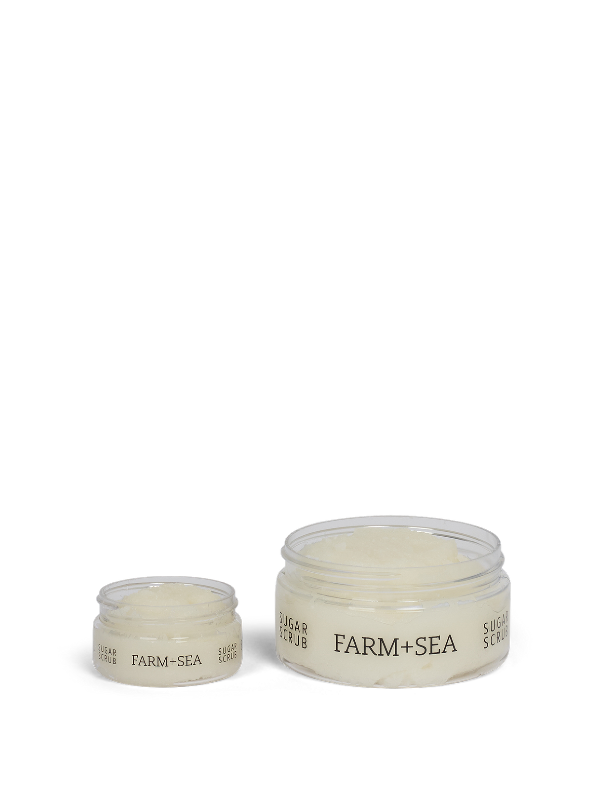 Large and small jars of 'Farm + Sea' sugar srcub on a white background